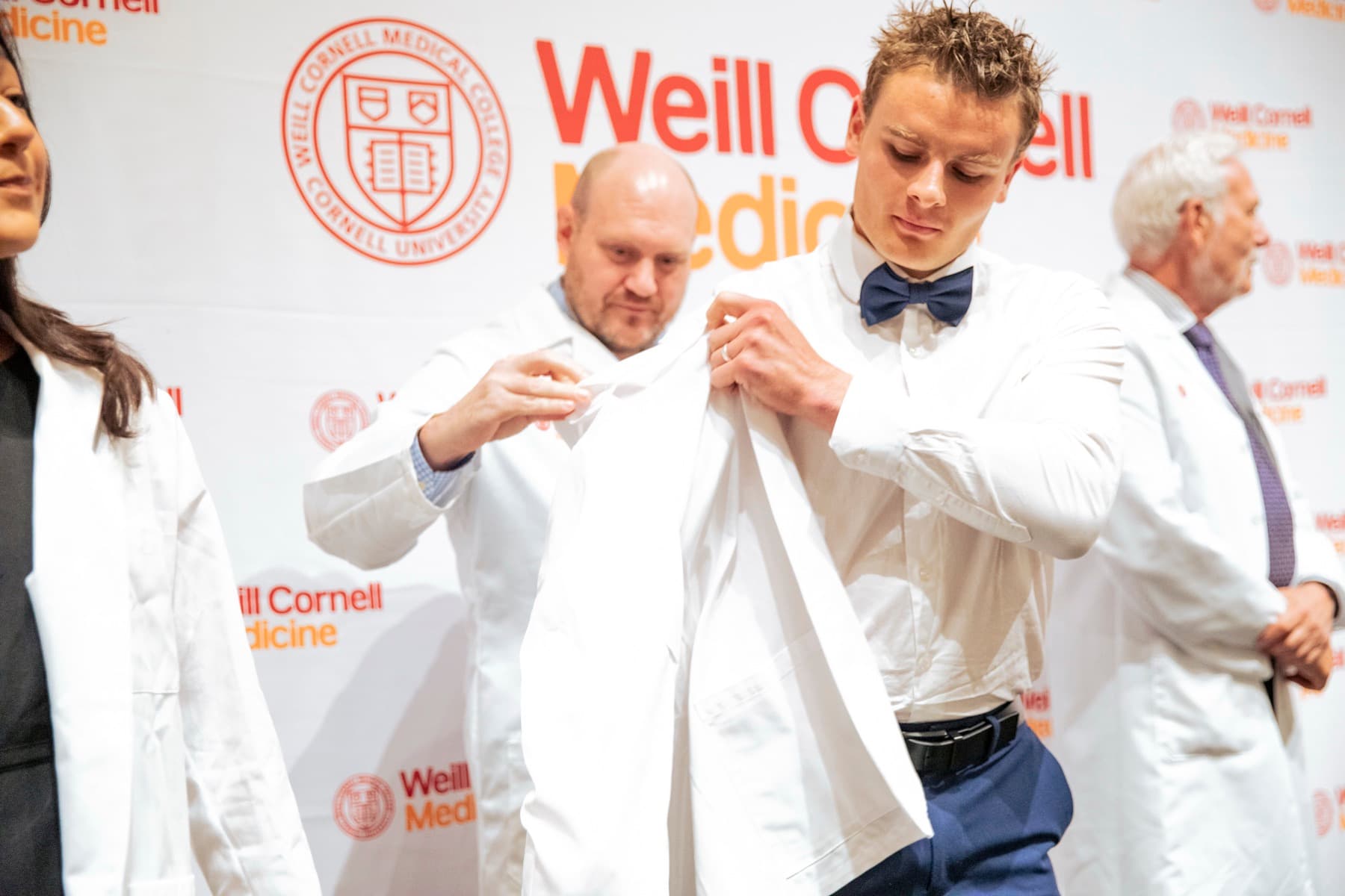 Nate Roy receiving his white coat at Weill Cornell Medicine