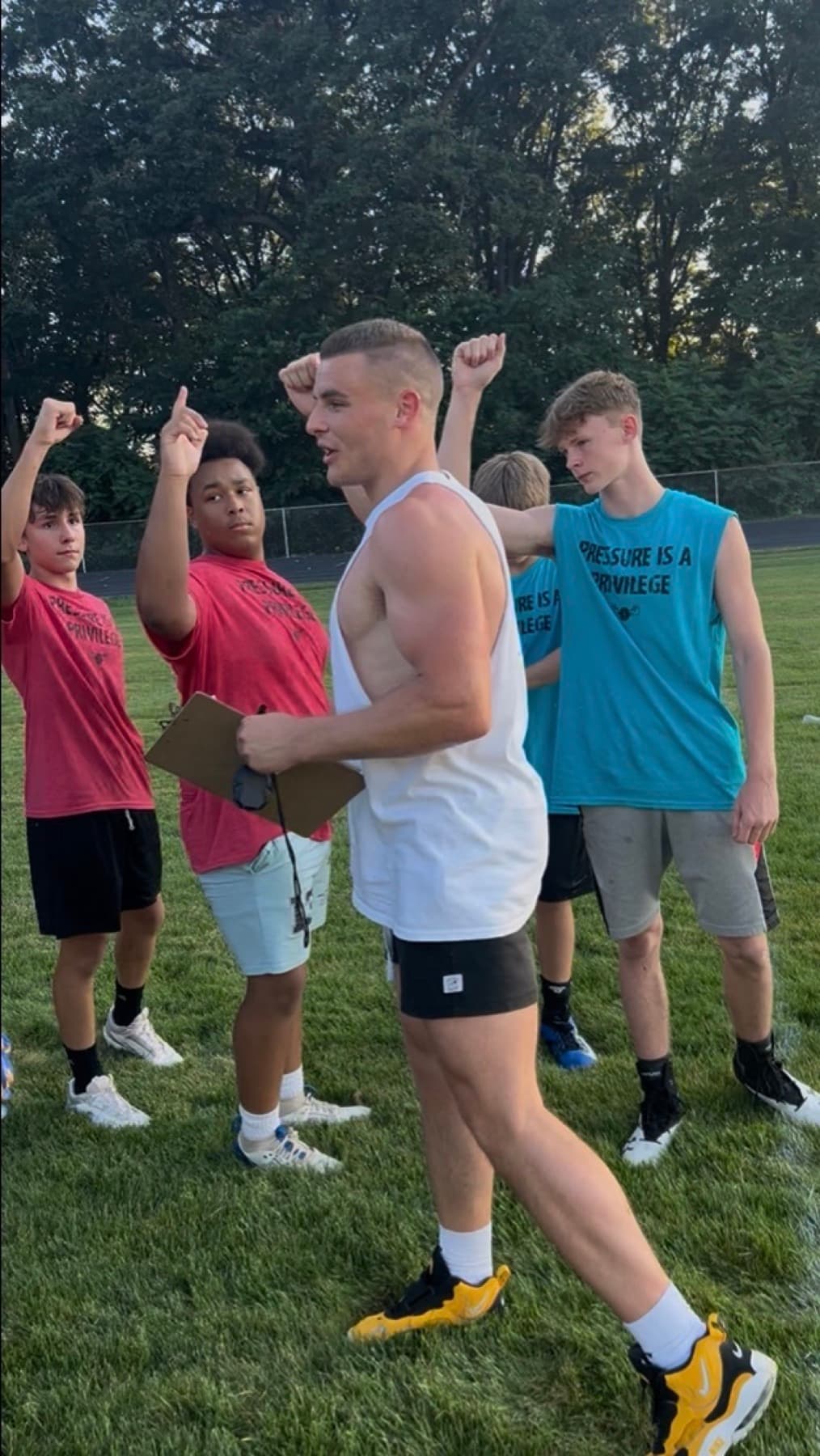 Nate Roy coaching a group of young athletes