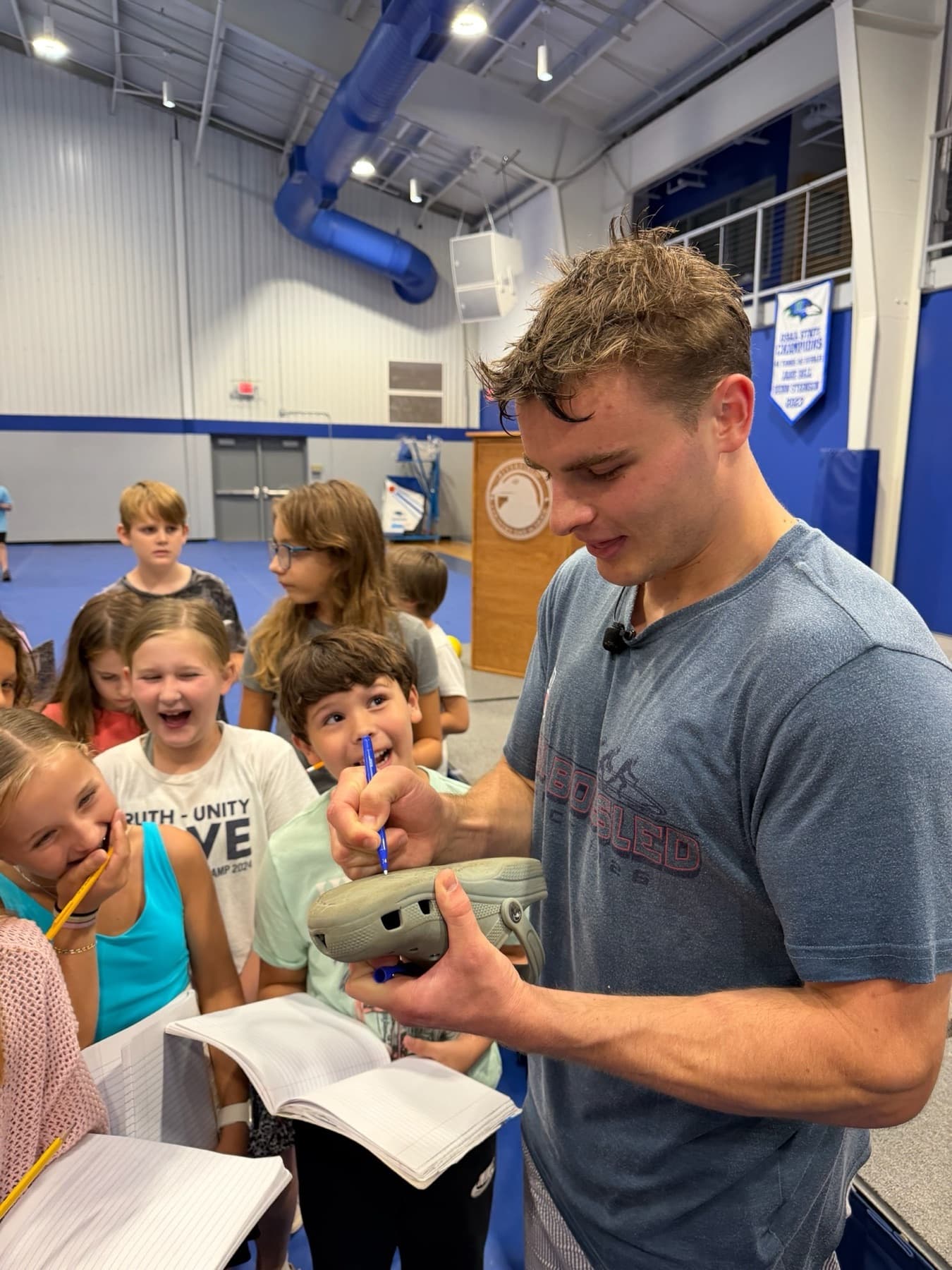 Nate Roy with young students