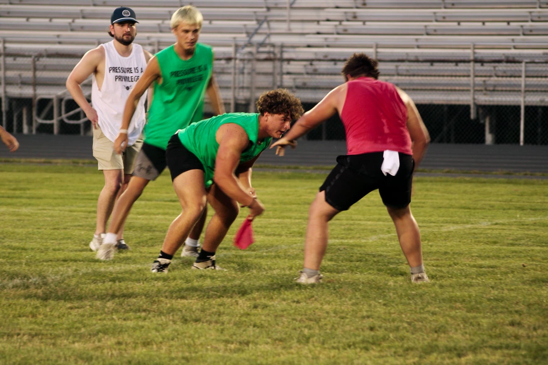 Athletes squaring off in a drill at an evening session