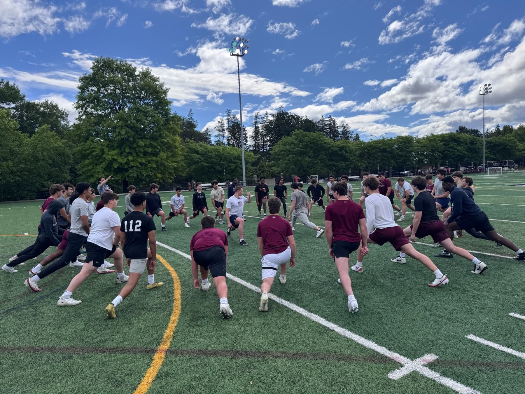 A team warming up on the turf with Cortex Flex